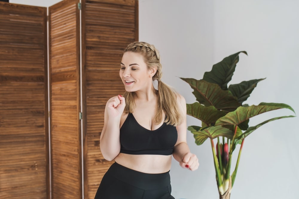 Happy,Plus,Size,Woman,In,A,Black,Sports,Top,And